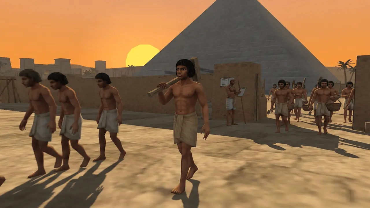 Workers walk home at sunset beneath the pyramid